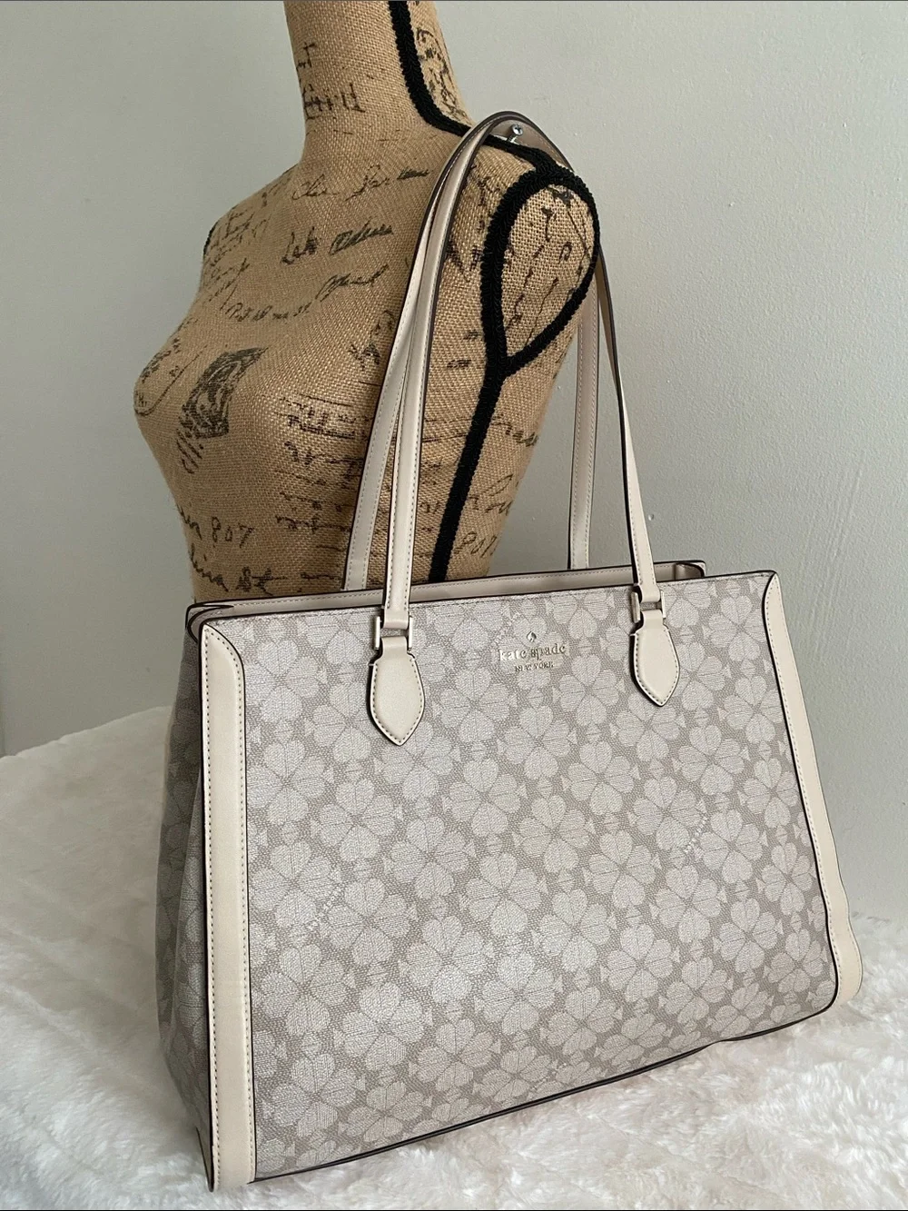 Kate Spade New York Signature Spade Flower East West Laptop Tote in Dark Beige
